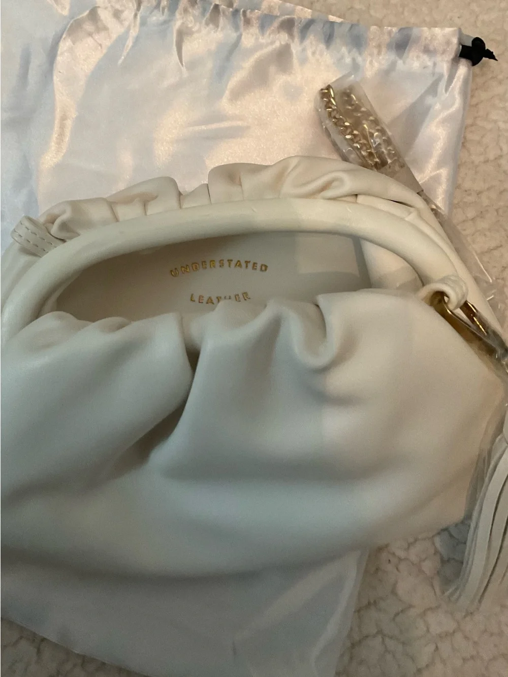 Understated Leather crescent cream